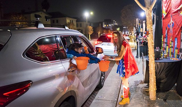 Family enjoying the Halloween Trick or Treat